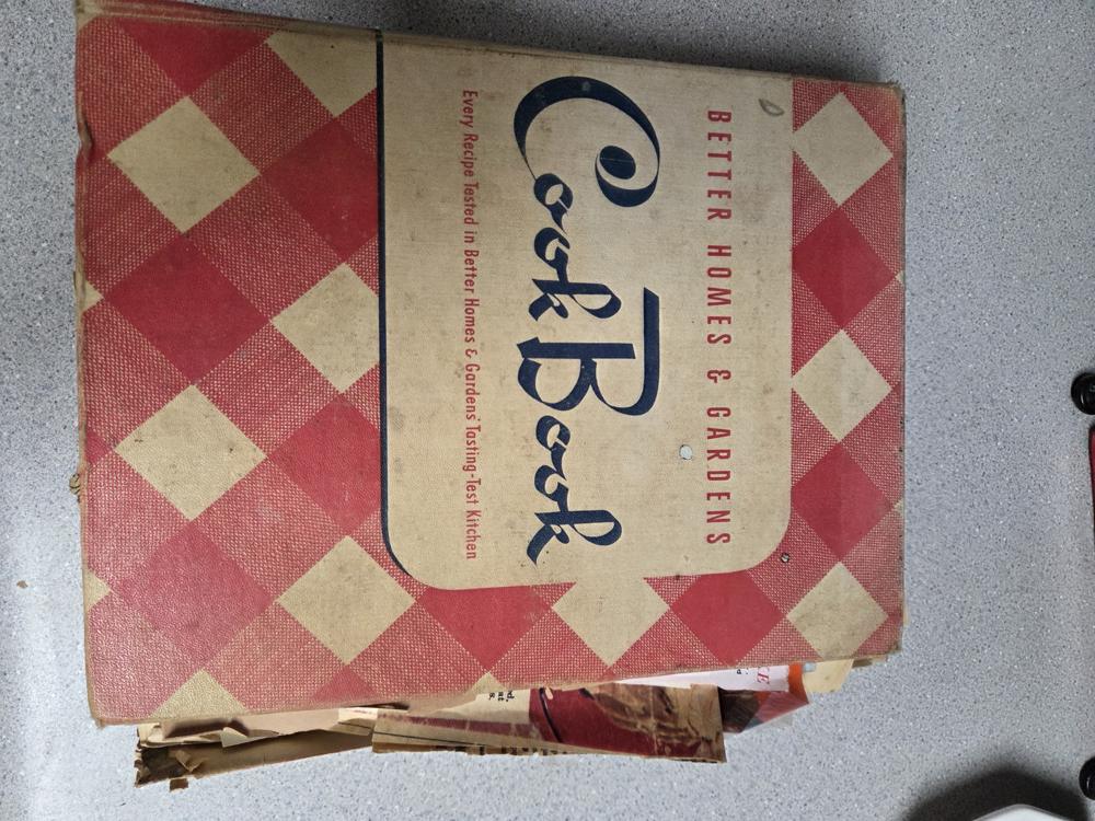 Grandmother's 1940s Better Homes & Gardens cookbook, stuffed with decades of clippings and handwritten recipes